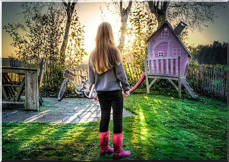 girl playing in the garden