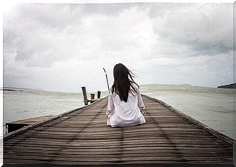 young man sitting on deck