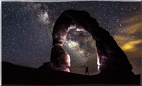 man in landscape under starry sky