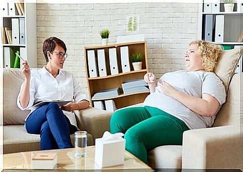 Psychologist attending to an obese patient