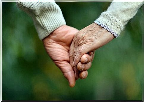 Hands-of-two-elderly-grasping people