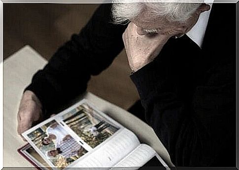 Elderly viewing photo album