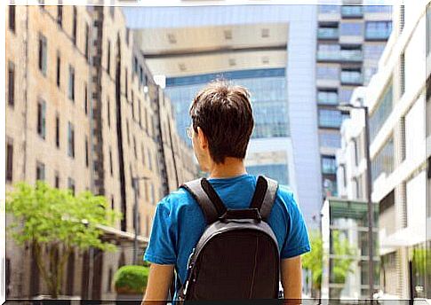 Man with backpack in another country