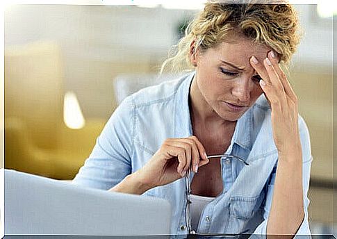 tired woman in front of computer