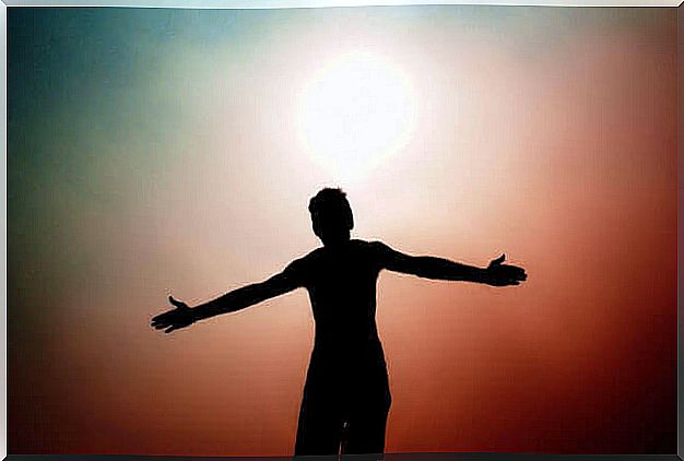 man facing the sun