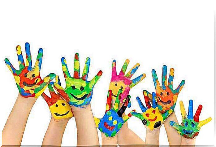 Children's hands painted with colored paint