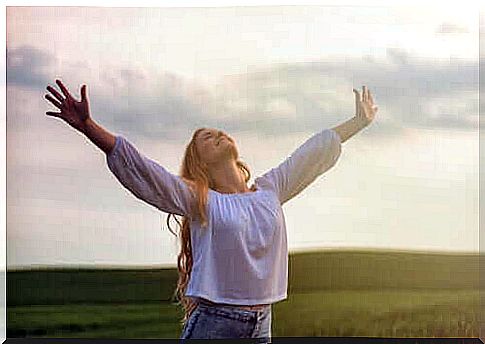 woman smiling with open arms