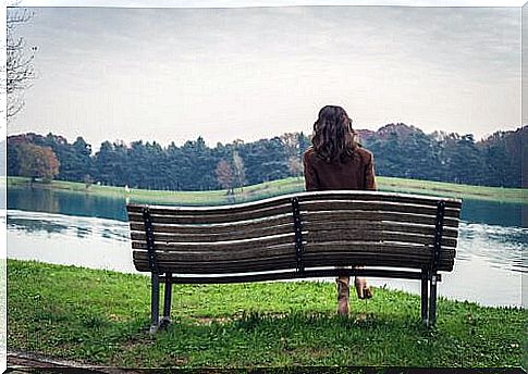 woman sitting on park bench