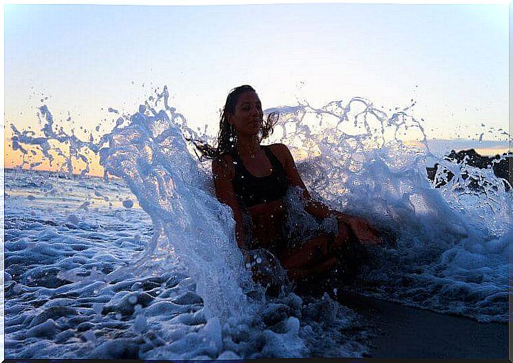 woman meditating in the sea